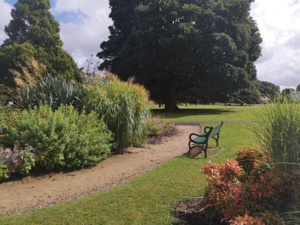 Courtney park in Newton Abbot, garden area with a bench